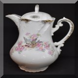 P85. Teapot decorated with bird and blossoms. Lid repaired. 